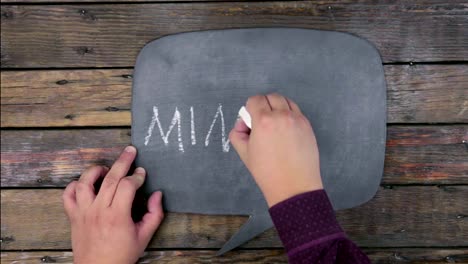 Man-writes-the-word-MINING-with-chalk-on-a-chalkboard,-stylized-as-a-thought.