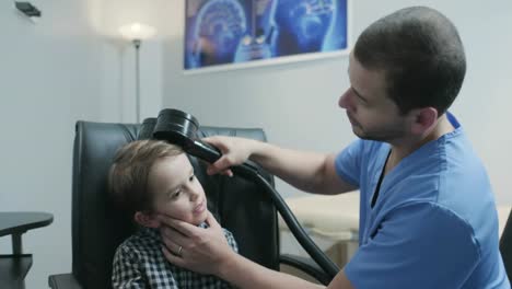 Little-Boy-Undergoing-Transcranial-Magnetic-Stimulation-In-Hospital-Health-Clinic