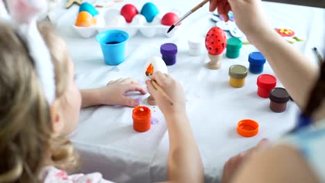 Painting-with-Brushes-on-Easter-Egg