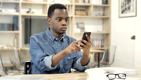 African-Man-Using-Smartphone,-Texting-Message