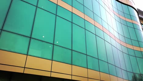 Modern-design-of-a-new-greenand-yellow-architecture-with-glass-mirror-windows