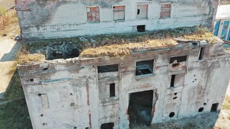 Front-side-of-abandoned-building-exterior-without-doors-and-windows.