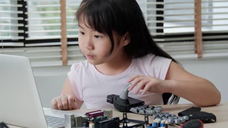 Little-girl-working-at-laboratory-alone,-Assembling-and-Testing-to-equipment-in-workshop.-People-with-technology-and-innovation-concept.