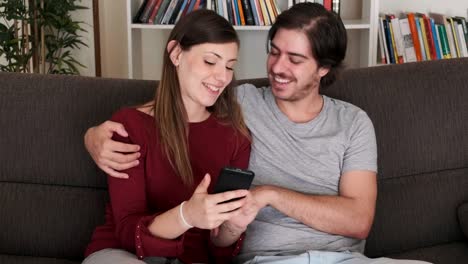 Video-about-young-couple-using-mobile-phone