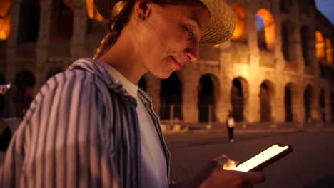 Smiling-caucasian-hipster-girl-satisfied-with-maps-on-smartphone-while-sightseeing-in-Rome-using-4G-connection-and-GPS-tracking-routes-and-notable-places