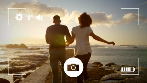 Taking-photos-of-a-couple-on-a-digital-camera