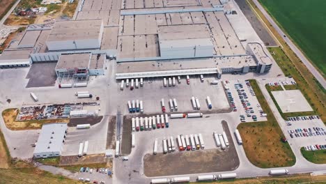 Aerial-view-of-warehouse-with-trucks.