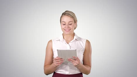 Beautiful-girl-holding-a-tablet-touch-pad-computer-gadget-swiping-pages-and-looking-in-camera,-Alpha-Channel