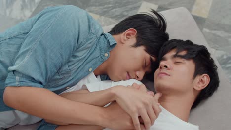 Young-Asian-gay-couple-sleep-together-at-home.-Teen-korean-LGBTQ-men-happy-relax-rest-lying-on-bed-in-bedroom-at-house-in-the-morning.