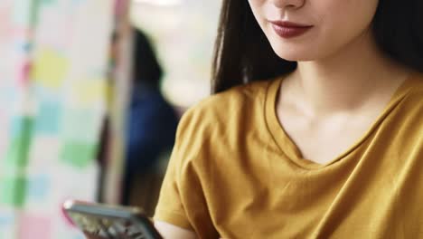 Handheld-view-of-woman-enjoying-the-free-internet-at-cafe