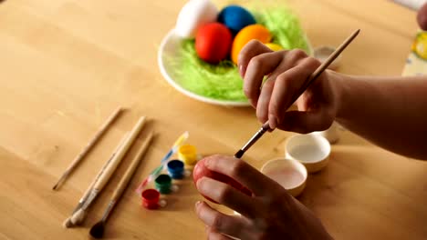 Female-Hand-Painted-Easter-Eggs-with-a-Brush