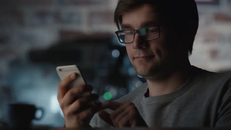 Man-Using-Mobile-Phone-in-Coffee-Shop