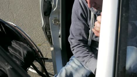 Disabled-man-in-wheelchair-getting-out-of-a-car.