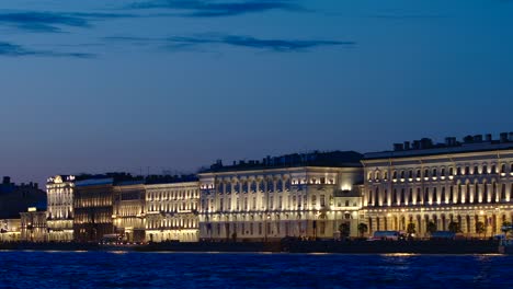 Illuminated-historic-buildings-on-an-embankment-of-the-Neva-river-in-the-White-Nights