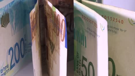 Israeli-money,-shekels-bills-in-motion