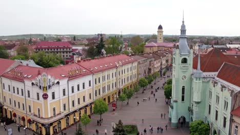 Aerial-view-Peace-Square-of-Mukachevo.-Nearby-is-the-Gothic-chapel-of-St.-Joseph,-city-hall-і-Cathedral-Church-of-St.-Martine.-Eastern-Carpathian-mountains.-Ukraine