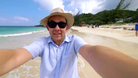 Happy-man-taking-a-selfie-in-Hawaiian-beach-in-4k-slow-motion--60fps