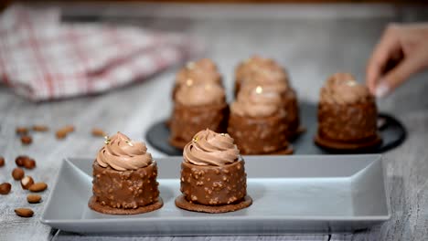 French-cake-with-caramel-and-nuts-inside.-Luxury-dessert-covered-with-chocolate-glaze.