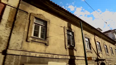 View-from-window-to-old-dilapidated-houses-untouched-by-urbanization,-old-city