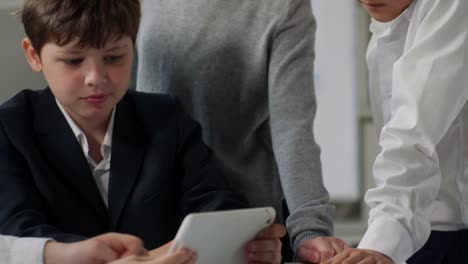 Several-Children-Using-Tablet