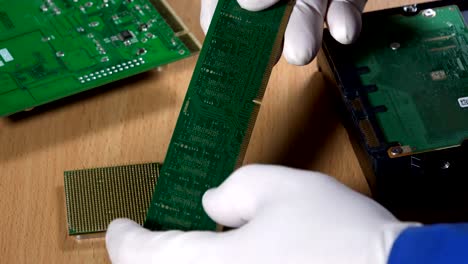 hands-examining-computer-RAM-memory-module.-Computer-diagnostics