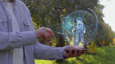 Man-shows-hologram-with-astronaut