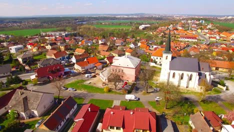 Camera-flight-over-small-village-Litice-suburb-of-Pilsen.-Living-in-agricultural-landscape.-Environmentally-friendly-living.-Czech-Republic,-Europe.