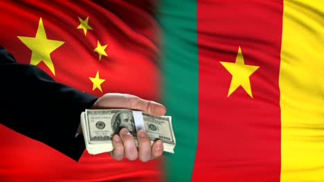 China-and-Cameroon-officials-exchanging-tank-money,-arms-trade,-flag-background