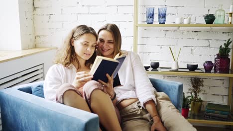 Girlfriends-reading-book-in-chair