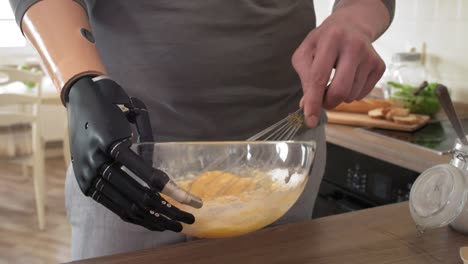 Male-Amputee-with-Bionic-Wrist-Holding-Bowl-and-Mixing-Batter