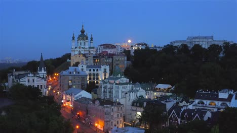 Aerial-view-of-St.-Andrew's-Church,-Ministry-of-Foreign-Affairs,-St.-Michael's-Cathedral-at-night-with-a-full-moon