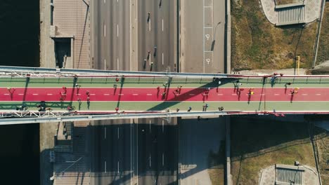 Marathon-running-on-the-footbridge-and-road.-Top-view-shot