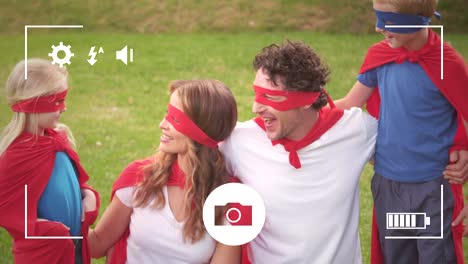 Taking-photos-of-family-in-garden-on-a-digital-camera