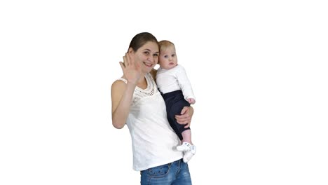 Happy-mom-and-cute-kid-baby-son-waving-hands-saying-hi-to-camera-on-white-background