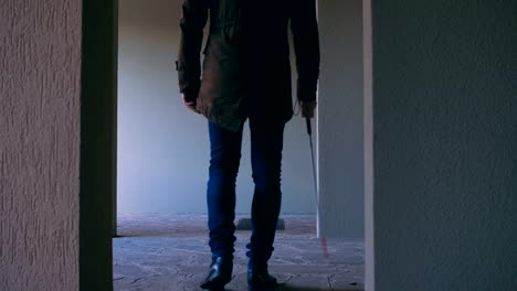 Blindness,orientation,autonomy.Blind-man-walking-with-stick-in-empty-apartment