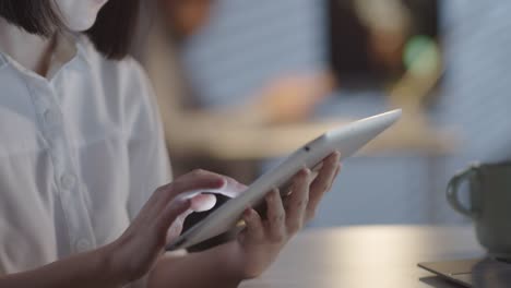 Businesswoman-Using-Tablet-in-Office