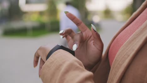 Unrecognizable-Businesswoman-Using-Smartwatch