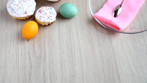 On-the-festive-table-alongside-with-painted-eggs-appears-dish-and-Easter-cake.