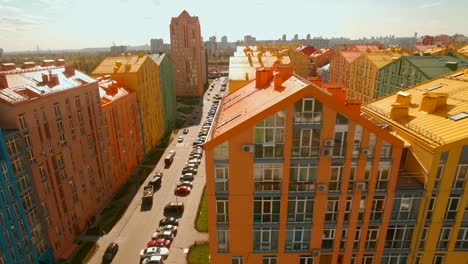 Flying-over-cozy-comfortable-colorful-buildings-in-a-European-city-4K-UHD-aerial