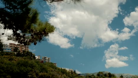 On-a-high-hill-there-are-houses-among-the-greenery-in-the-summer