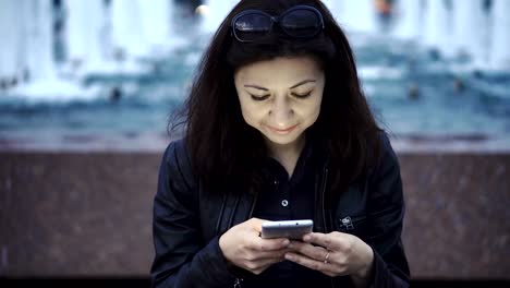 Woman-using-smartphone-and-surfing-social-media