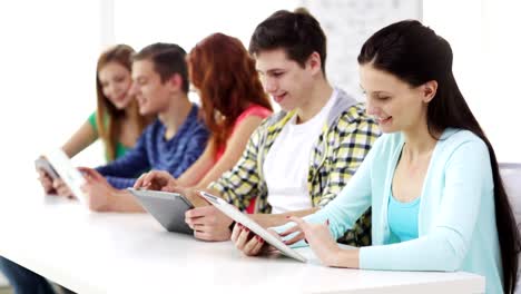 happy-students-with-tablet-pc-computers-learning-at-school