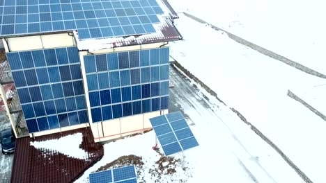 Hotel-complex-in-the-mountains-with-solar-panels-on-the-snow.