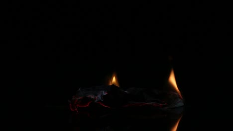 Dollar-bill-in-flames.-American-money-burning-on-black-background.