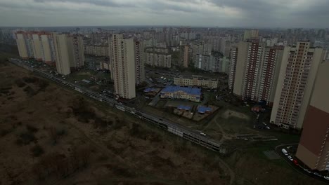 Aerial-drone-footage-of-gray-urban-city-outskirts-with-identical-houses