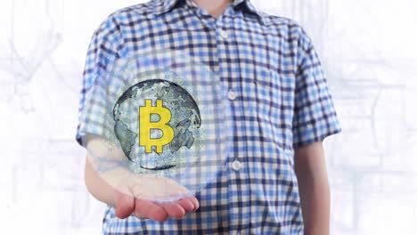 Young-man-shows-a-hologram-of-the-planet-Earth-and-Sign-BTC