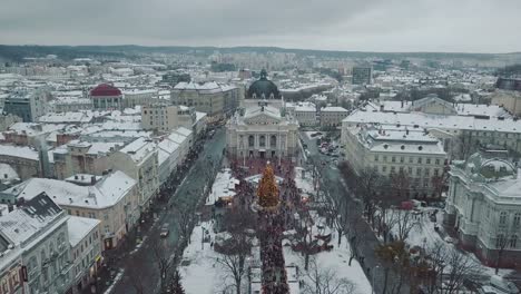 Lviv,-Ukraine.-Arial-shot.-Opera-house.-Christmas-tree.-Christmas-Fair.-People-are-walking-around-the-city-center.-Winter