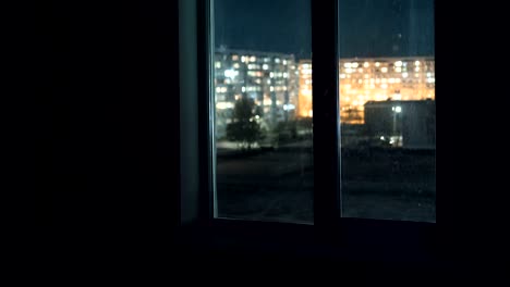 View-through-the-Window-at-the-Lights-the-Windows-in-High-rise-Buildings-at-Night