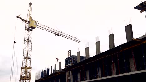 The-construction-site-has-workers-and-a-construction-crane