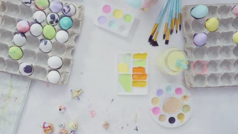 Little-girl-and-her-mom-painting-Easter